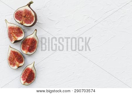 Fresh Figs On A White Background. Healthy Snack And Food. Top View Of Figs. Place For Text.