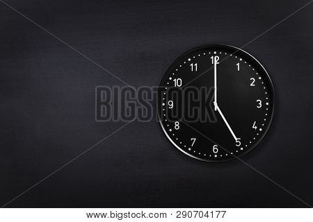 Wall Clock Showing Five Oclock On Black Chalkboard Background. Office Clock Showing 5am Or 5pm On Bl