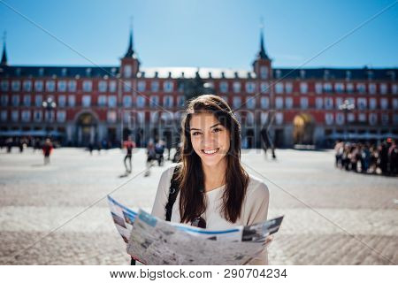 Young Happy Woman Exploring Center  Of Madrid. Visiting Famous Landmarks And Places.cheerful Female