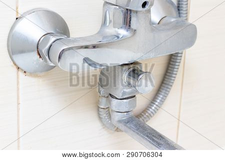 Dirty Calcified Shower Mixer Tap, Faucet With Limescale On It, Close Up.