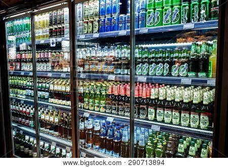 Minsk, Belarus, March 21, 2019: Many Bottles Of Beer Of Different Brands Show On A Shelf For Sale In