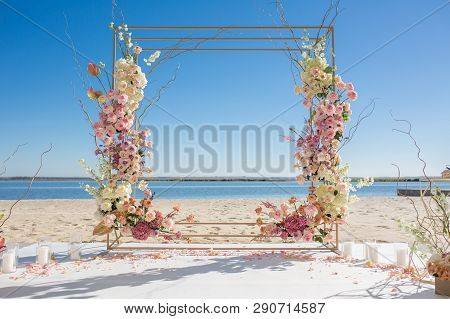 Event Decoration. Wedding Chuppa At Riverside Decorated With Fresh Flowers. Florist Workflow.