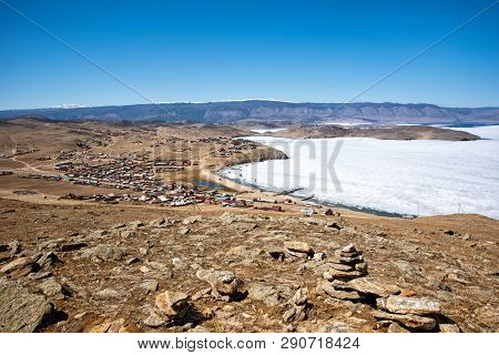 View Of Spring Landscape In Siberia With Part Of Frozen Lake Baikal In The Distance From The Top Vie