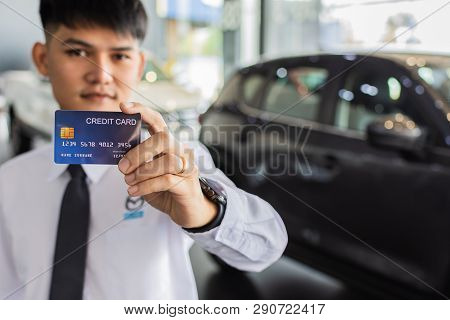 Man Holding Credit Card For Blurred Bokeh Background E-shopping Marketing Digital, Consumer Purchase