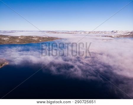 Aerial View. Hardangervidda Mountain Plateau, Norway Landscape. Morning Time, Clouds Over Lake Water