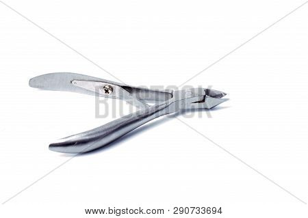 Nail Clippers To Remove The Cuticle And Nail Care Products On A Light Background.
