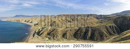 Clay Hills And Ravines As A Result Of Soil Erosion. The Foot Of Cape Meganom, Crimea. Sunny Day In E