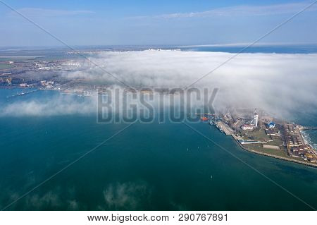 Aerial View Of Panoramic Seaport Warehouse And Container Ship, Crane Vessel Working For Delivery Of