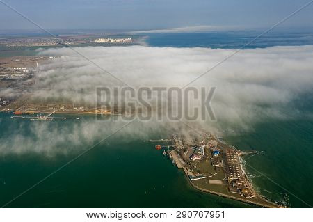 Aerial View Of Panoramic Seaport Warehouse And Container Ship, Crane Vessel Working For Delivery Of