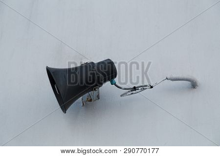 Speaker For Address The Passengers Mounted On The White Bulkhead Of A Ship