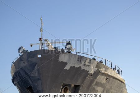 Bow Of The Cargo Vessel Against Sky