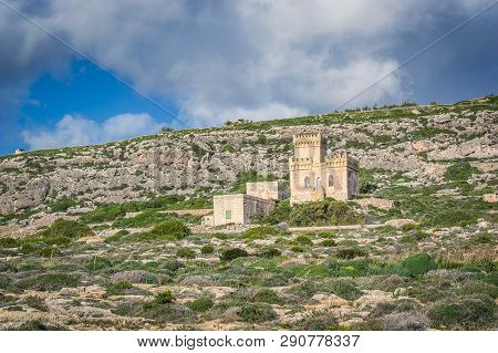 Ghar Lapsi Tower On A Hilly Landscape In Malta. Medieval Watchtower