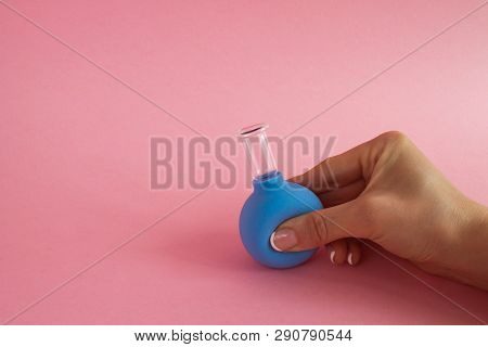 Female Hand With French Manicure Squeezes Medical Cosmetic Jar For Vacuum Massage Of Body And Face, 