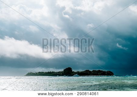 Maldives Background. Sunset Over The Tropical Sea And Coral Beach With Colorful Clouds In The Sky. B