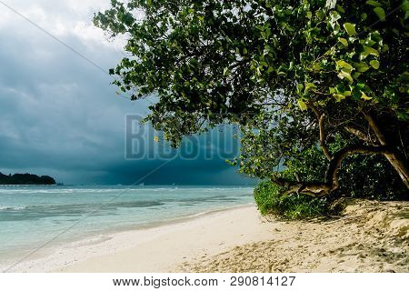 Maldives Background. Sunset Over The Tropical Sea And Coral Beach With Colorful Clouds In The Sky. B