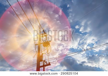 High Voltage Pole And Sunshine. Send Power From Clean Solar Energy To The Community