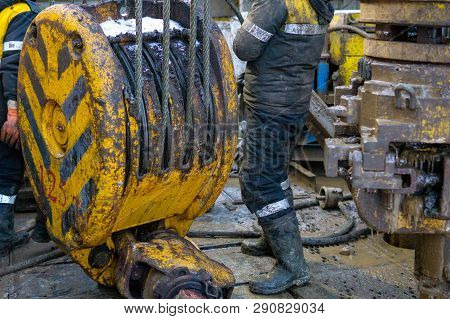 Oil And Gas Drilling Rig Onshore Dessert With Dramatic Cloudscape. Oil Drilling Rig Operation On The