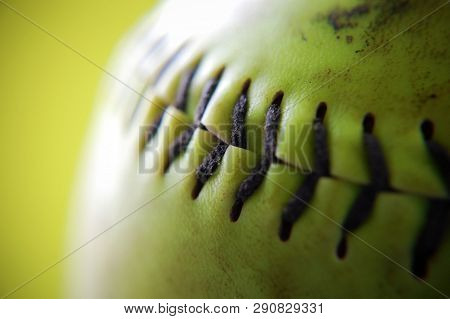 Macro Shot Of The Stitching On A Softball.