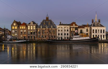 Maassluis, The Netherlands - February 26, 2019: The Harbor Of Maassluis With Old Boats, Tugs And Mon