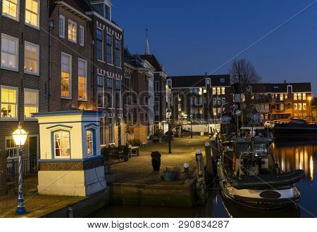 Maassluis, The Netherlands - February 26, 2019: The Harbor Of Maassluis With Old Boats, Tugs And Mon