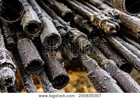 Oil Drill Pipe. Rusty Drill Pipes Were Drilled In The Well Section. Downhole Drilling Rig. Laying Th