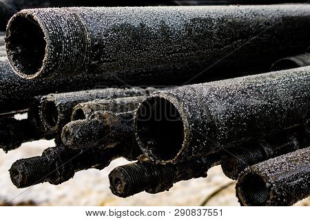 Oil Drill Pipe. Rusty Drill Pipes Were Drilled In The Well Section. Downhole Drilling Rig. Laying Th