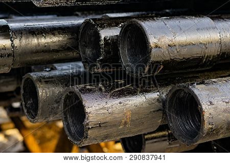Oil Drill Pipe. Rusty Drill Pipes Were Drilled In The Well Section. Downhole Drilling Rig. Laying Th