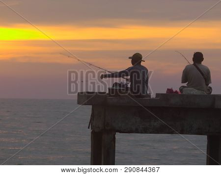 Port Dickson, Malaysia September 14, 2018 :  Jetty And Unidentified People Closeup During Sunset At 