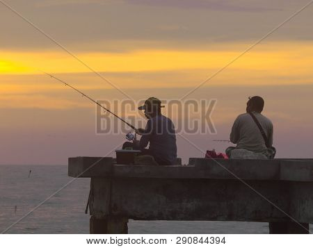 Port Dickson, Malaysia September 14, 2018 :  Jetty And Unidentified People Closeup During Sunset At 