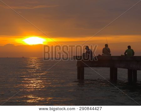 Port Dickson, Malaysia September 14, 2018 :  Jetty And Unidentified People Closeup During Sunset At 