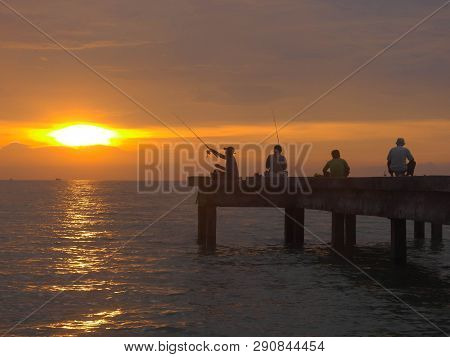 Port Dickson, Malaysia September 14, 2018 :  Jetty And Unidentified People Closeup During Sunset At 