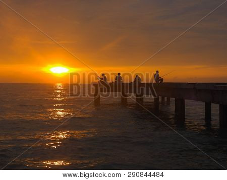 Port Dickson, Malaysia September 14, 2018 :  Jetty And Unidentified People Closeup During Sunset At 