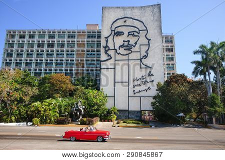 Plaza De La Revolution, Havana, Cuba - 30/03/2018: Tourists On A Red Retrocar Ride Through The Build