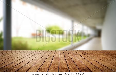 Wooden Brown Table Top Against The Blurred Corridor, Passage And Courtyard Of The House .for Product