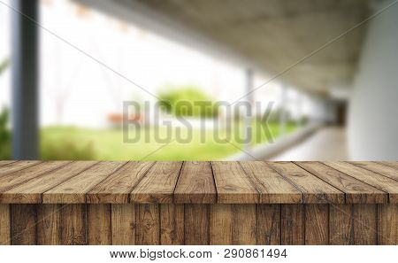 Wooden Brown Table Top Against The Blurred Corridor, Passage And Courtyard Of The House .for Product