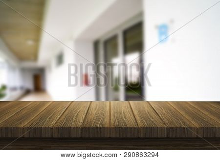 Wooden Brown Table Top Against The Blurred Corridor, Passage And Courtyard Of The House .for Product