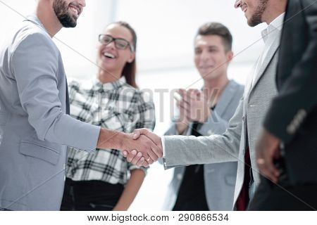 An attractive, diverse business team meeting as a grou