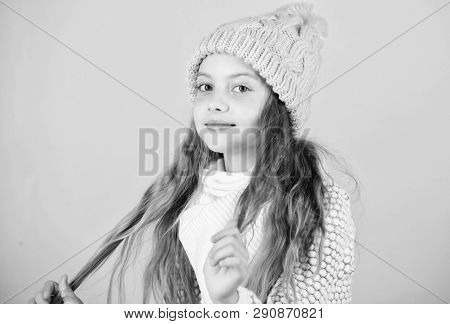 Girl Wear Knitted Hat Pink Background. Prevent Winter Hair Damage. Winter Hair Care Tips You Should 
