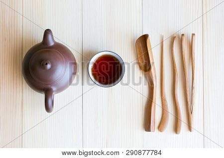 A Set Accessories For The Tea Ceremony. Dishes For Tea And Wooden Sticks On A Light Background.
