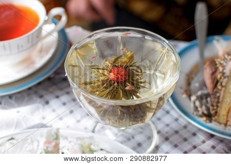 Drinking Green Tea In Transparent Glass With Flower Tasty