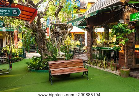 Pattaya, Thailand - December 06, 2018: Bench And Statue Are Near Cafe