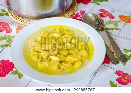 Traditional Italian Homemade Tortellini In Broth Soup. Real Italian Dinner In Countryside. Italian F