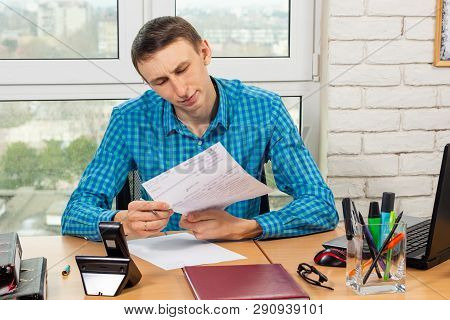The Supervisor Carefully Reads The Visitor’s Application