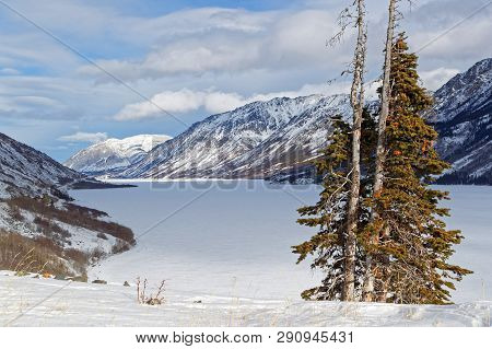 Frozen Tagish Lake, Surrounded By Moutains, Yukon