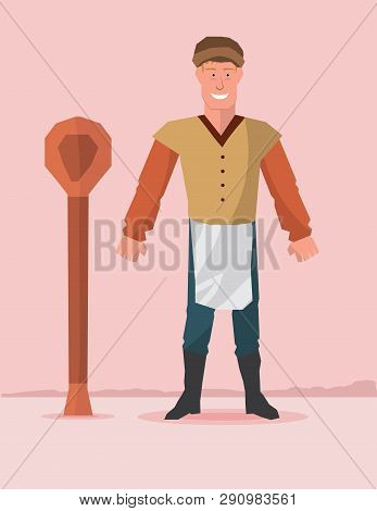 Baker Standing With Wooden Ladle Wearing Apron