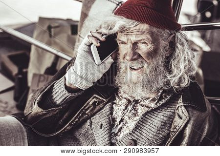 Old Almsman Finding New Phone And Deciding To Call To Someone.