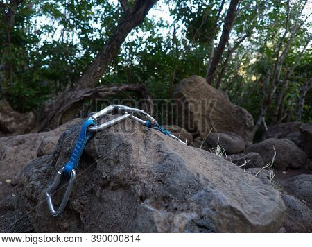 Focus On Quickdraws Put Down On A Rock With Blurred Front And Back