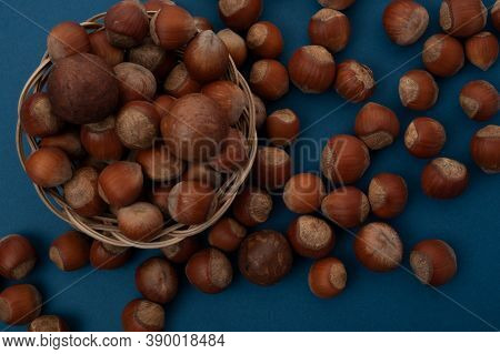 Sprinkled Nuts Lie On The Table And In A Basket