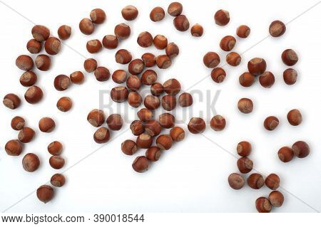 Sprinkled Nuts On A White Background, Top View