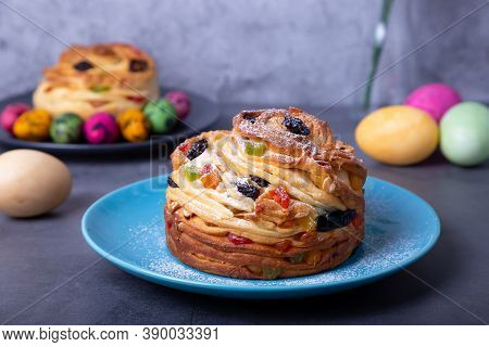 Craffin (cruffin) With Raisins, Nuts And Candied Fruits. Easter Bread Kulich And Painted Eggs. Easte